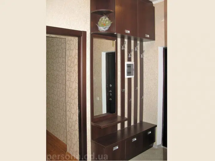 Coat rack with a mirror in a hallway