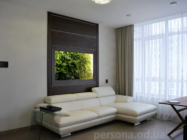 Green aquarium in a guest room