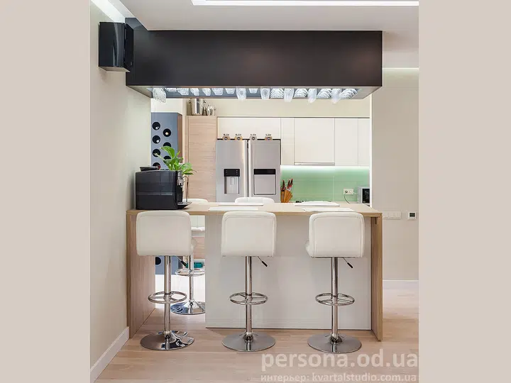 Kitchen with a bar counter, glass rack and bottle holder