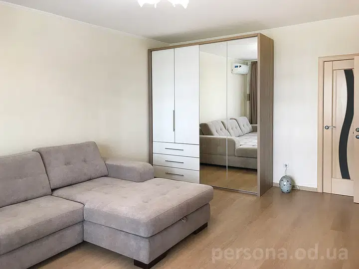 Bi-fold wardrobe with a mirror