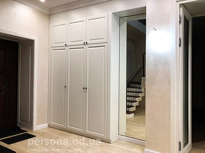 Classic white wardrobe by the entrance