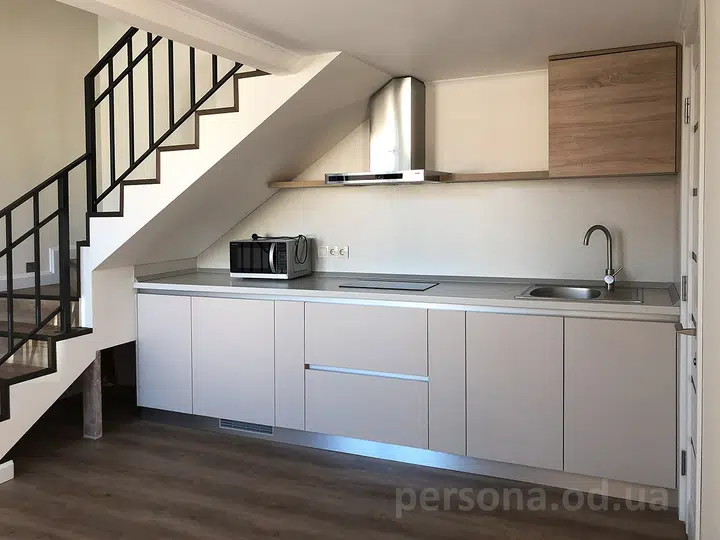 Kitchen under the stairs in a guest house