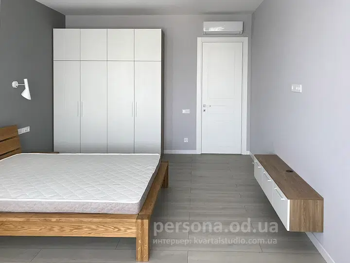 Hinged wardrobe and TV unit in a bedroom