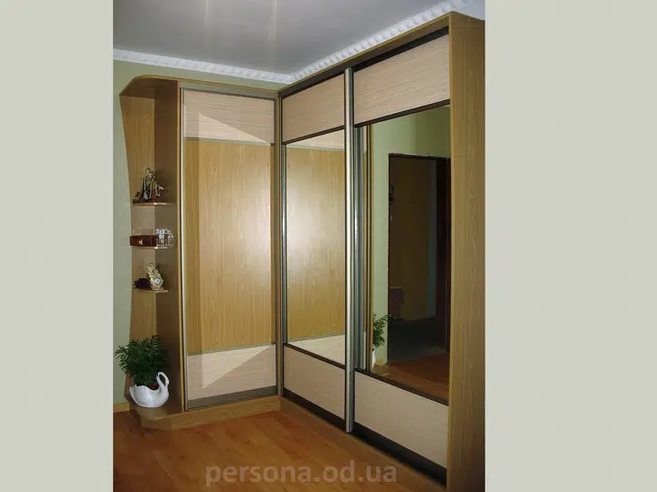 Corner wardrobe with a mirror in a hallway