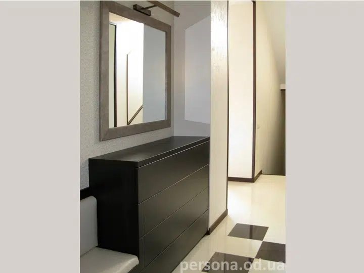 Chest of drawers with a mirror and small sofa