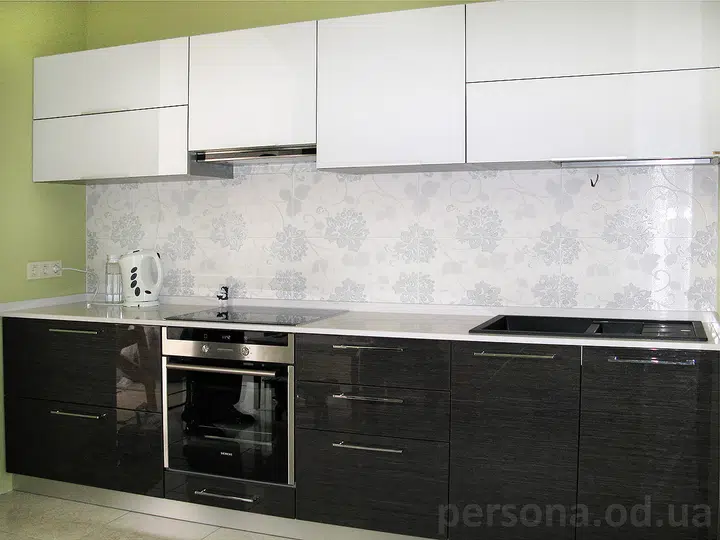 Grey veneered kitchen with glass