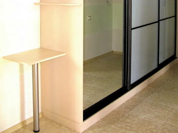 Hallway wardrobe with a small table for bags