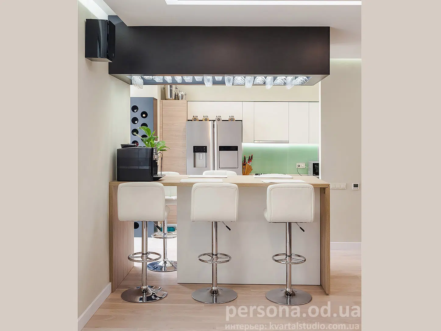 Kitchen with a bar counter, glass rack and bottle holder