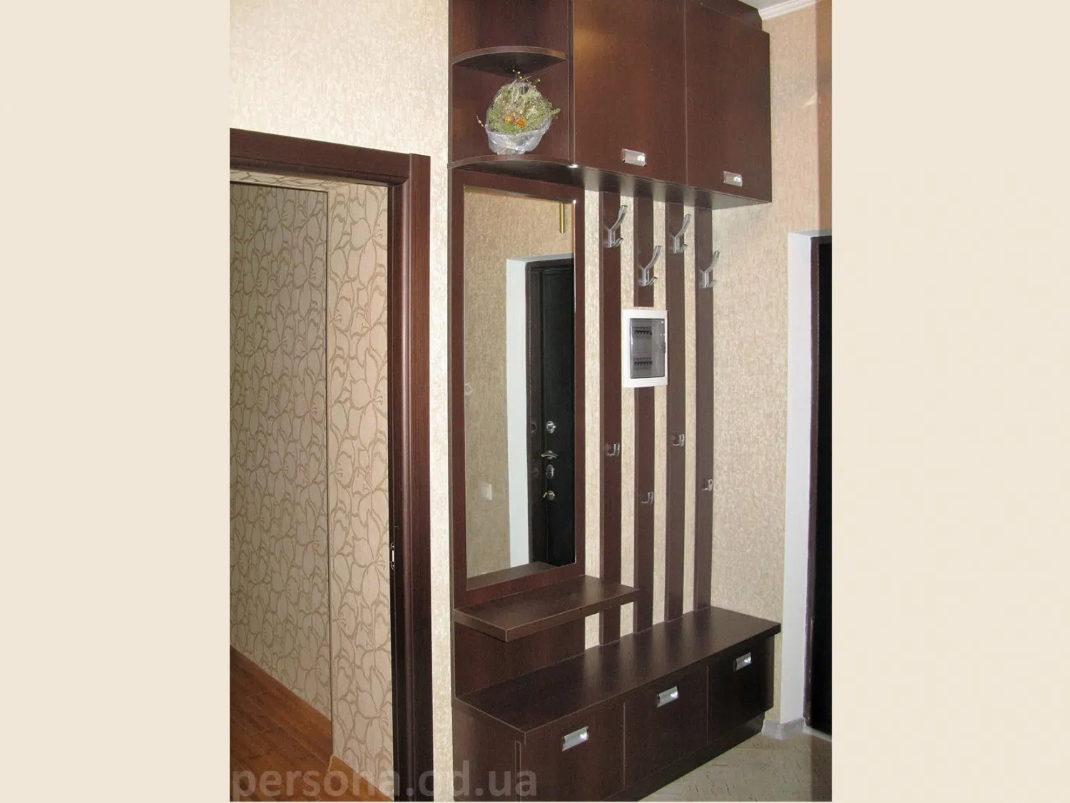 Coat rack with a mirror in a hallway