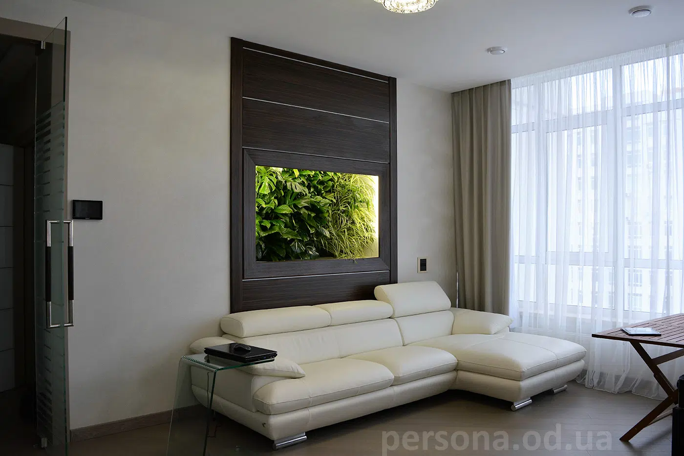 Green aquarium in a guest room