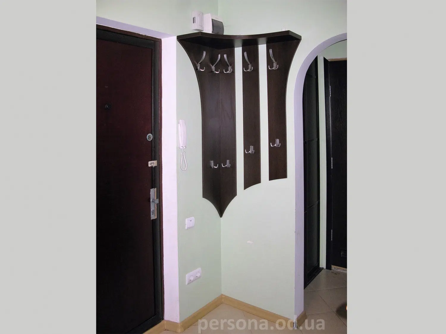 Corner coat rack for a hallway