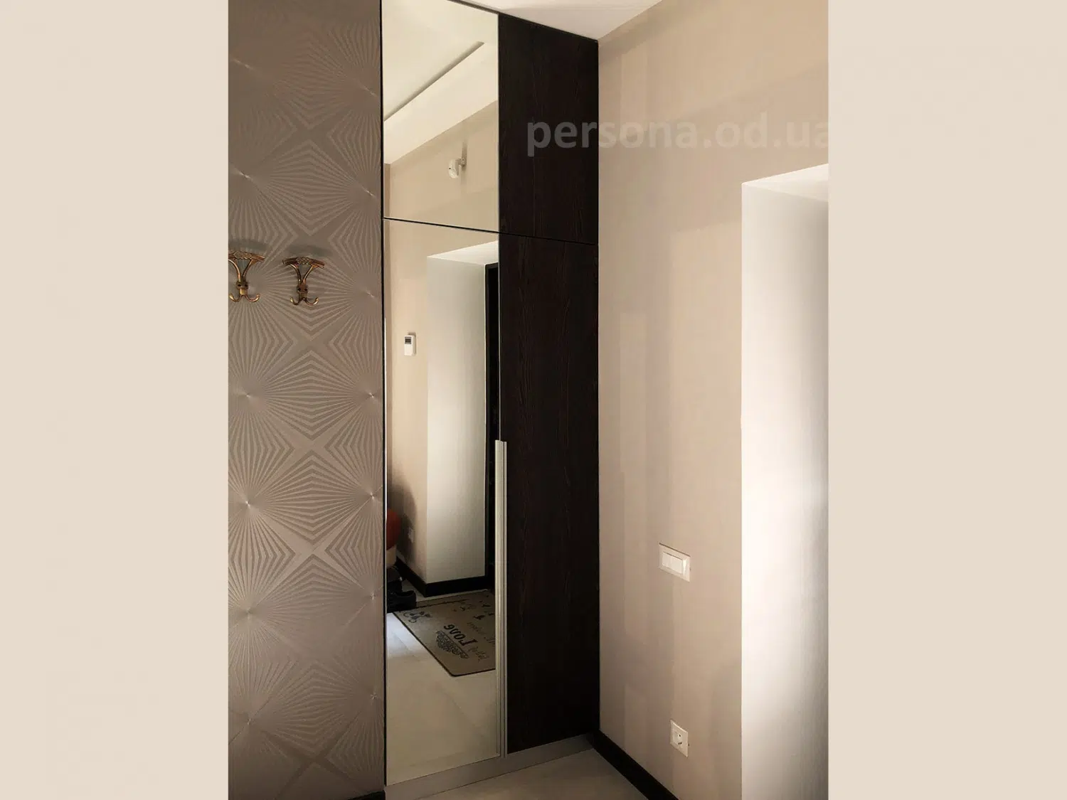 Wardrobe with a mirror by the entrance